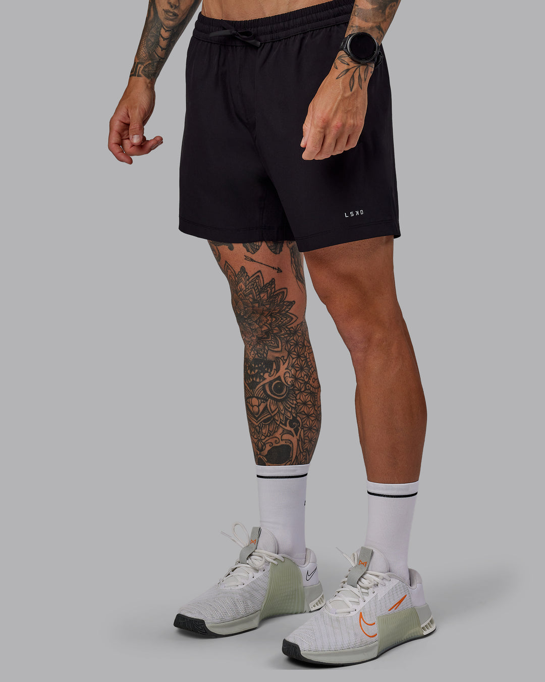 Man wearing Rep 5&quot; Lined Performance Shorts in Black | Size:S