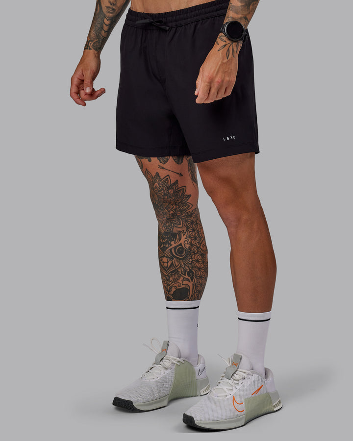 Man wearing Rep 5&quot; Lined Performance Shorts in Black | Size:S
