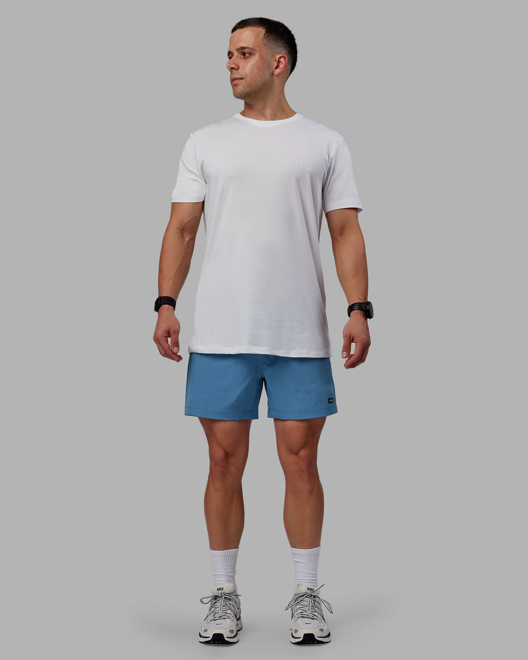 Man wearing Rep 5&quot; Performance Shorts - Elemental Blue