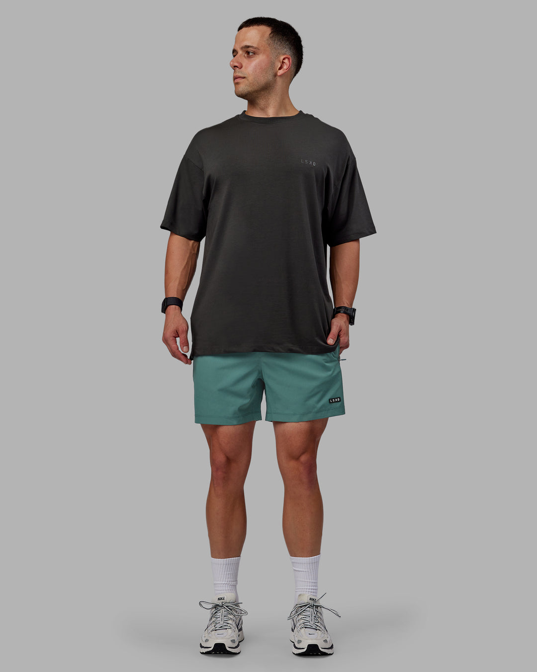 Man wearing Rep 5&quot; Performance Shorts - Sage Bush