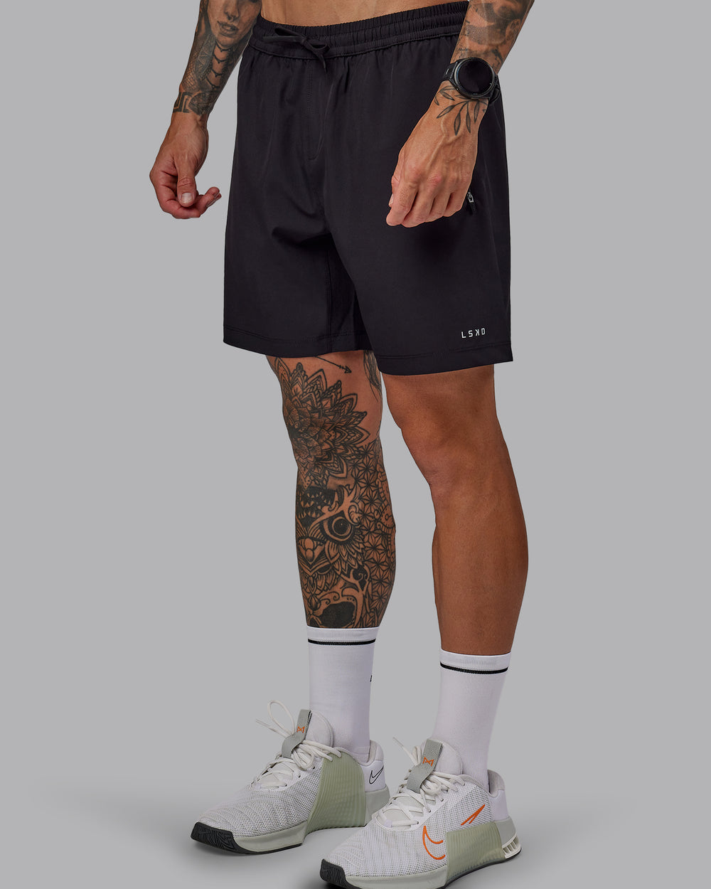 Man wearing Rep 7'' Performance Short in Black-White | Size:S