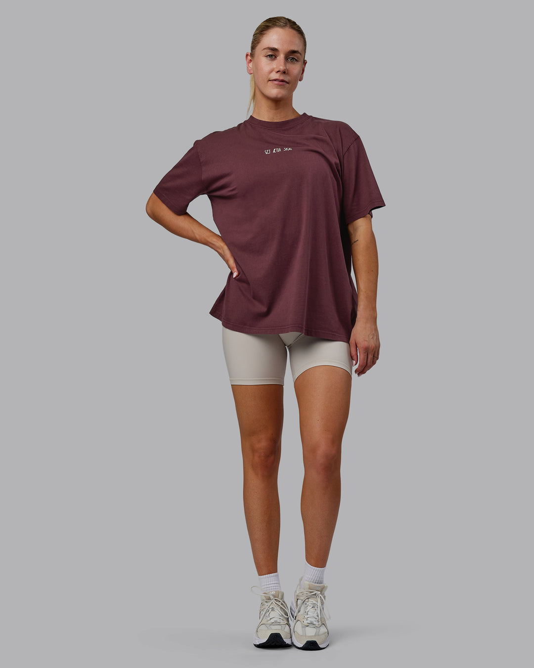 Woman wearing Sara I Can Shall &amp; Will Oversized Washed Tee - Bordeaux-Shale Beige