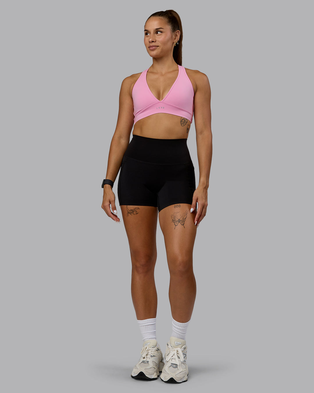 Woman wearing Stamina Sports Bra - Bubblegum