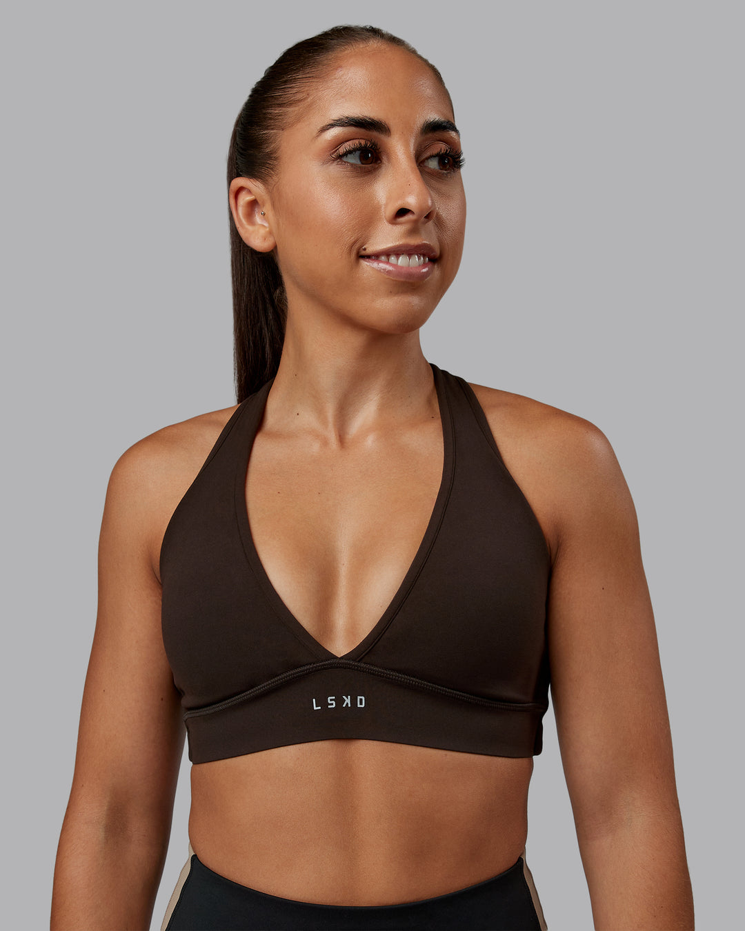 Woman wearing Stamina Sports Bra - Dark Walnut | Model:Tylah | Size:S