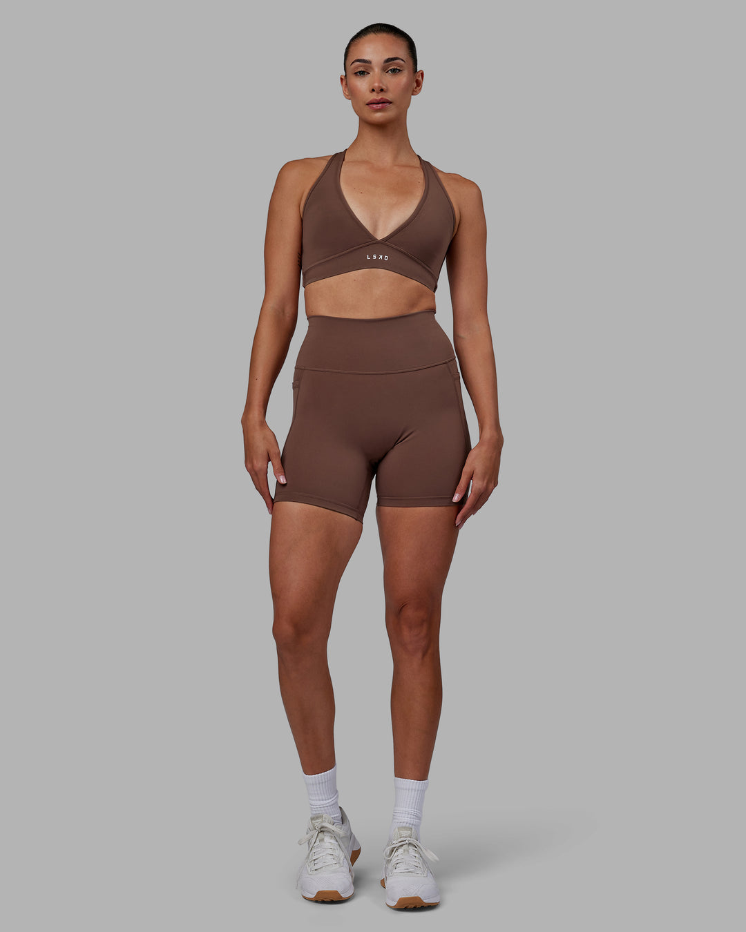 Woman wearing Stamina Sports Bra - Dull Rust