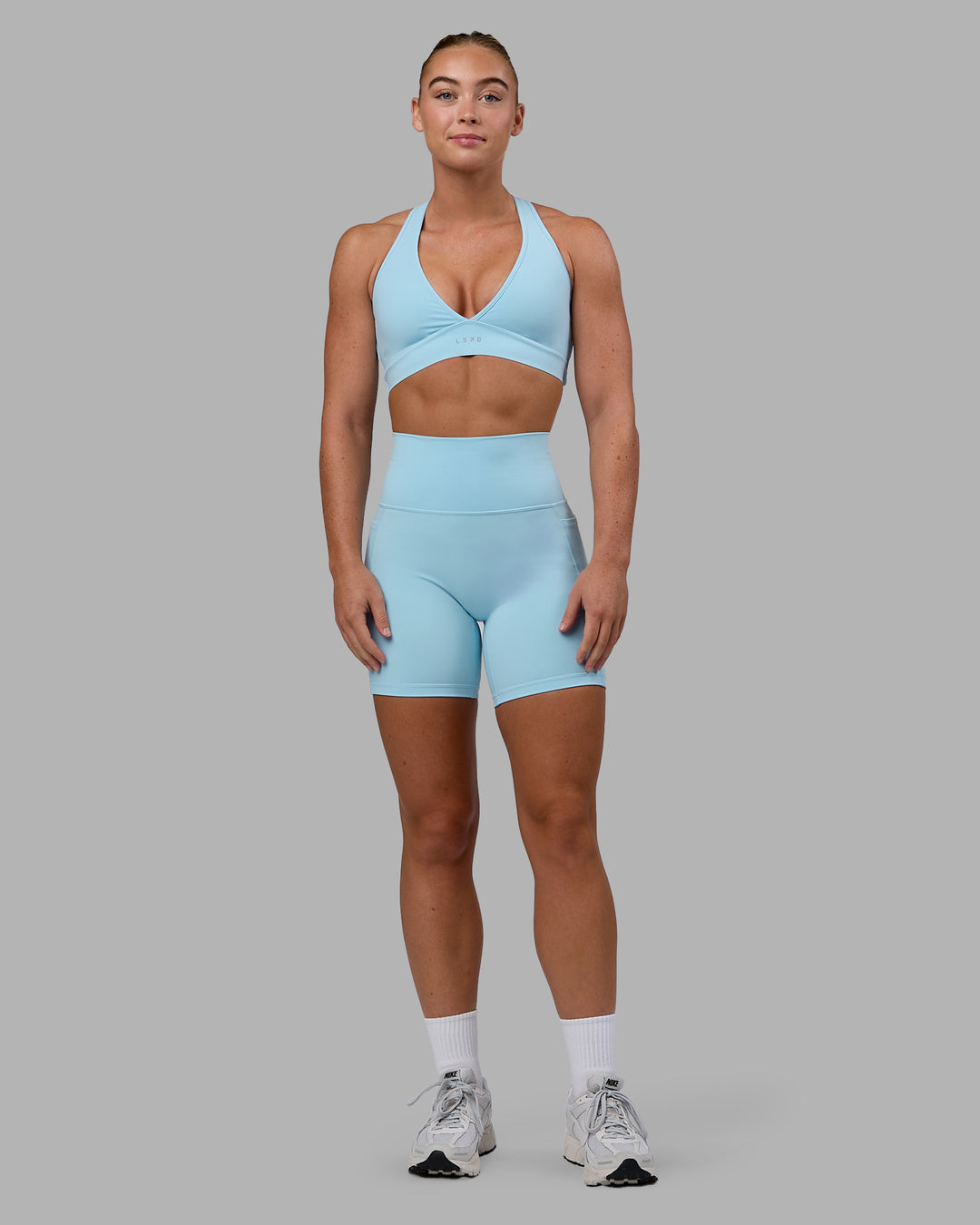 Woman wearing Stamina Sports Bra - Glacial Blue