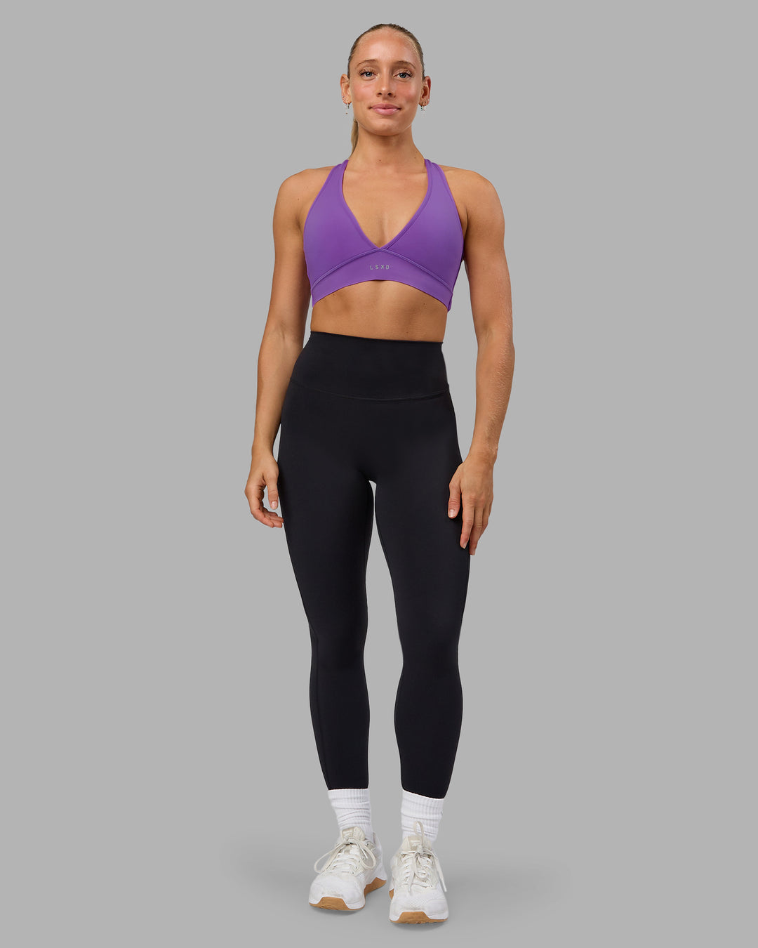 Woman wearing Stamina Sports Bra - Purple Swirl