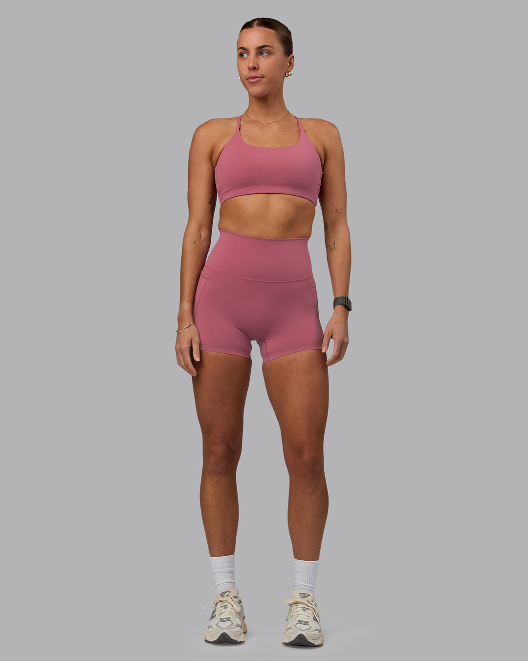 Woman wearing Twist Sports Bra - Mauve Haze