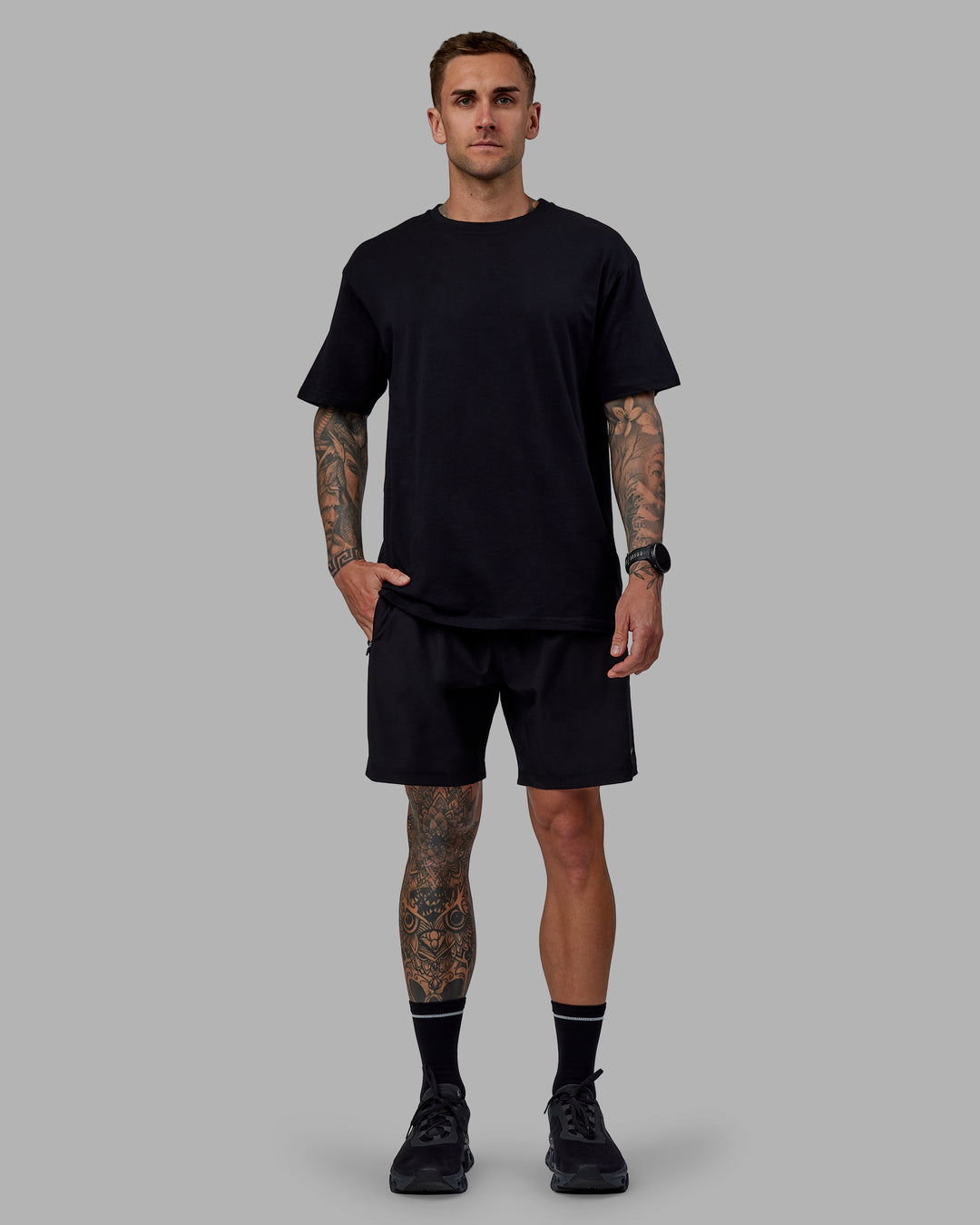 Man wearing Unisex Keep On Running FLXCotton Oversize Tee - Black-White