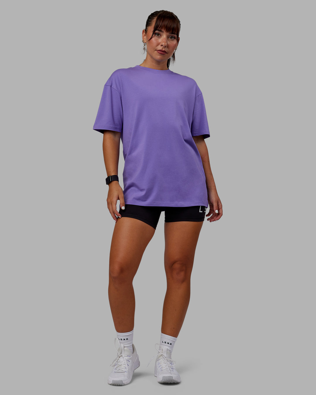 Woman wearing Unisex Lifting Club FLXCotton Tee Oversize - Dahlia Purple-Black