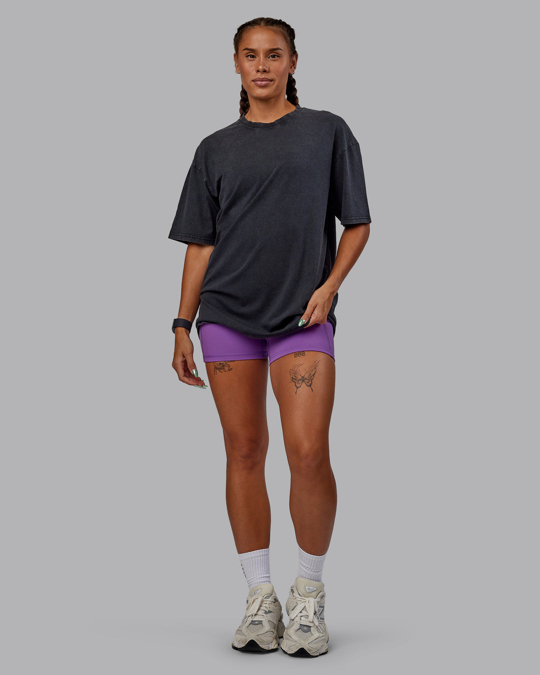 Woman wearing Unisex Miami25 Washed FLXCotton Tee Oversize - Black-Amethyst