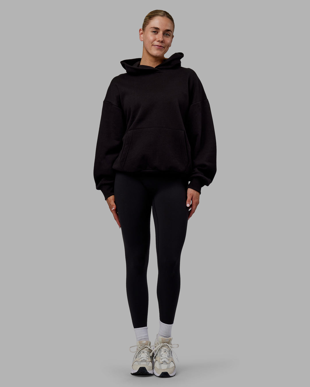 Woman wearing Sara Unisex Hoodie Oversize - Black-Black