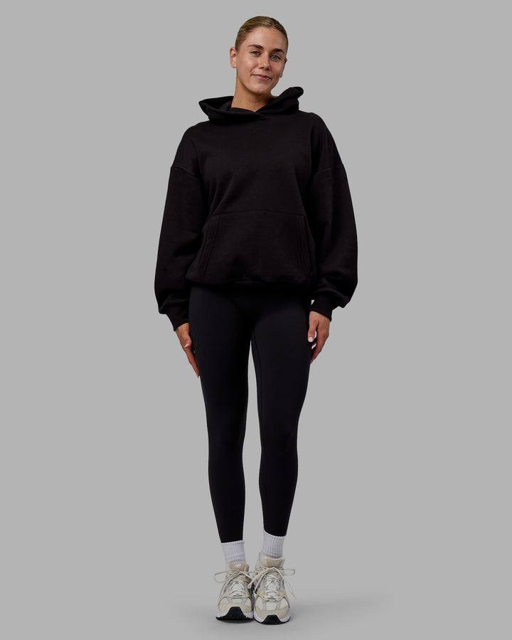 Woman wearing Sara Unisex Hoodie Oversize - Black-Black
