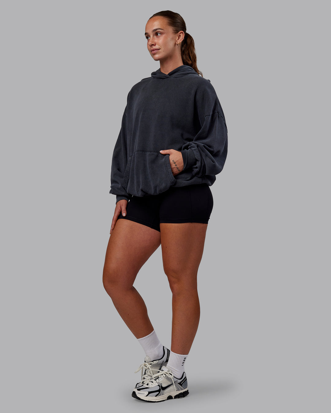 Woman wearing Set the Standard Washed Oversized Hoodie in Black-Black | Size:S