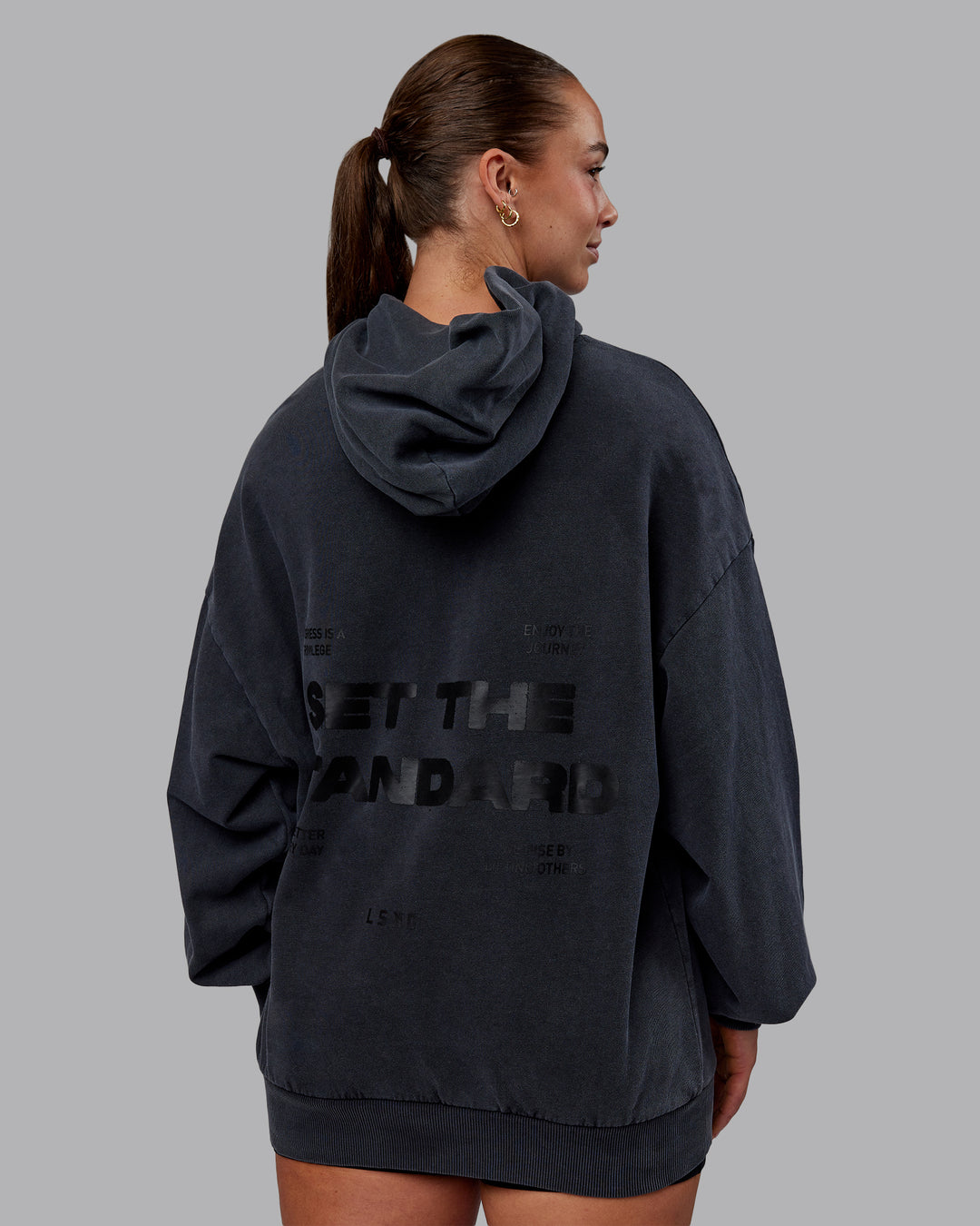 Woman wearing Set the Standard Washed Oversized Hoodie in Black-Black | Size:S