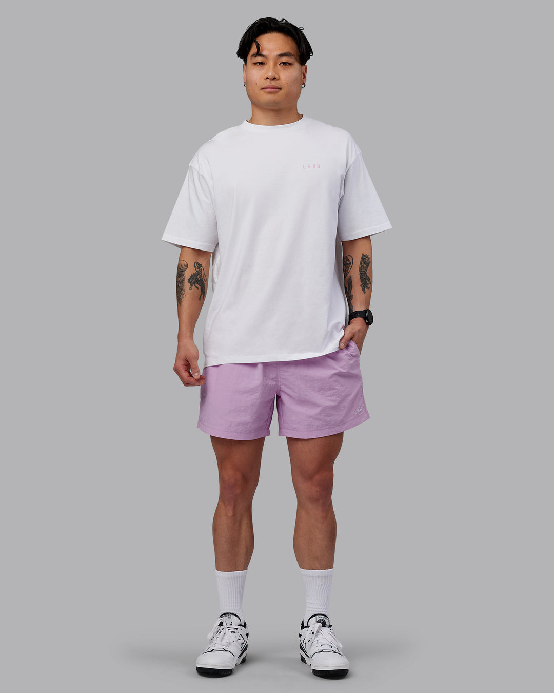 Man wearing Unisex Strike Through FLXCotton Tee Oversize - White-Bubblegum