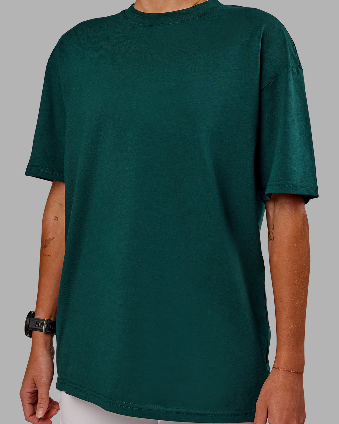 Woman wearing Variation FLXCotton Oversized Tee in Dark Moss-Digital Mist | Size:S