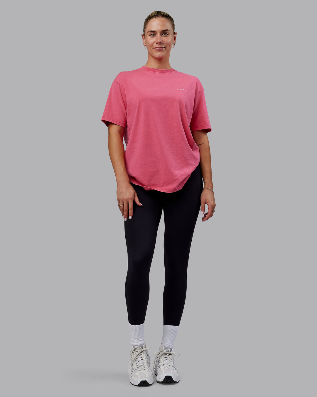 Woman wearing Unisex Washed Empower Tee Oversize - Berry Pink-Pastel Orchid