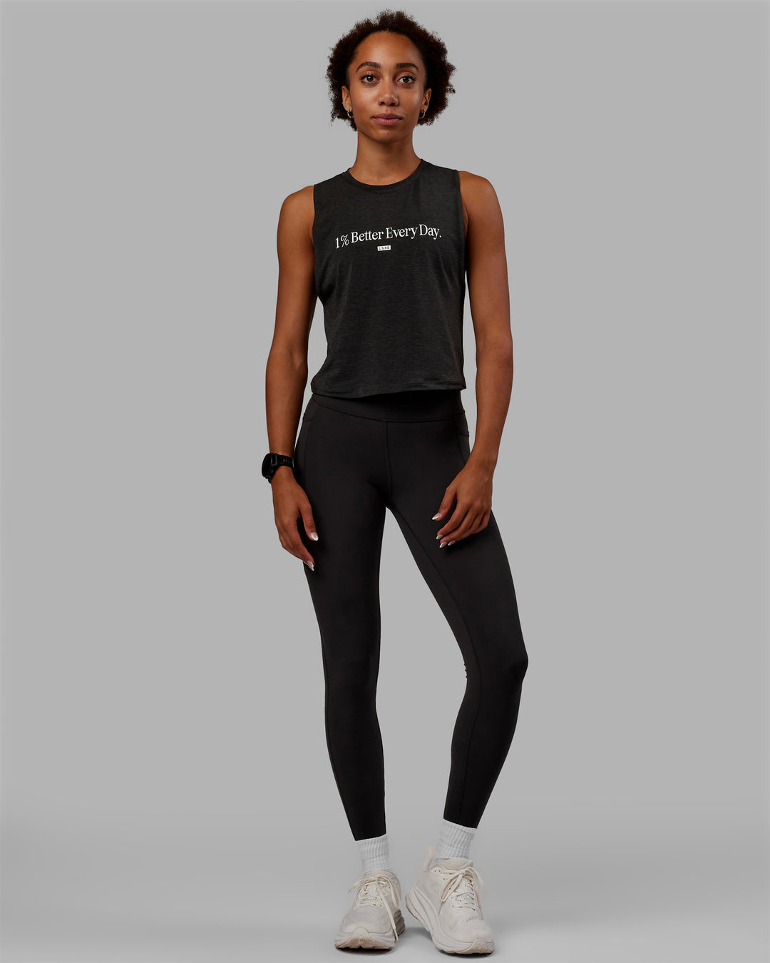 Woman wearing Vital 1% Better Cropped Training Tank - Charcoal Marl-White