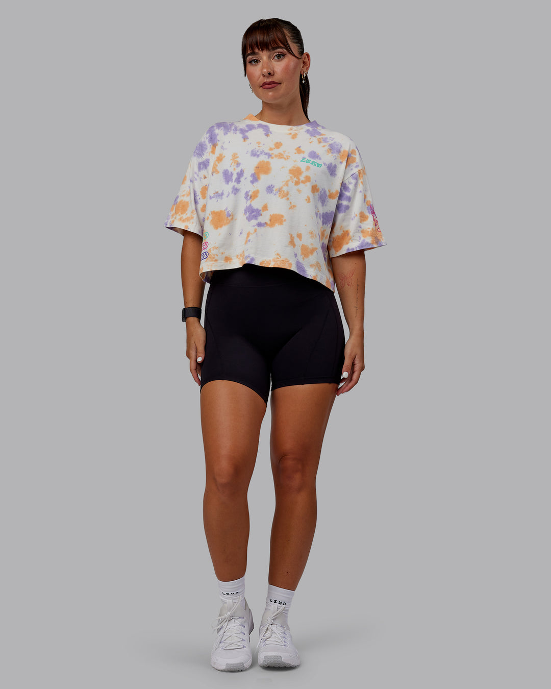 Woman wearing Washed Huntington 24 Cropped Heavyweight Tee - Tie Dye Tangerine-Dahlia Purple