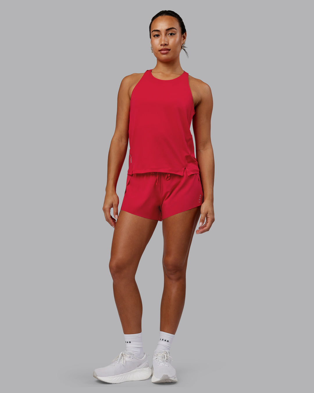 Woman wearing Pace Running Tank - Scarlet