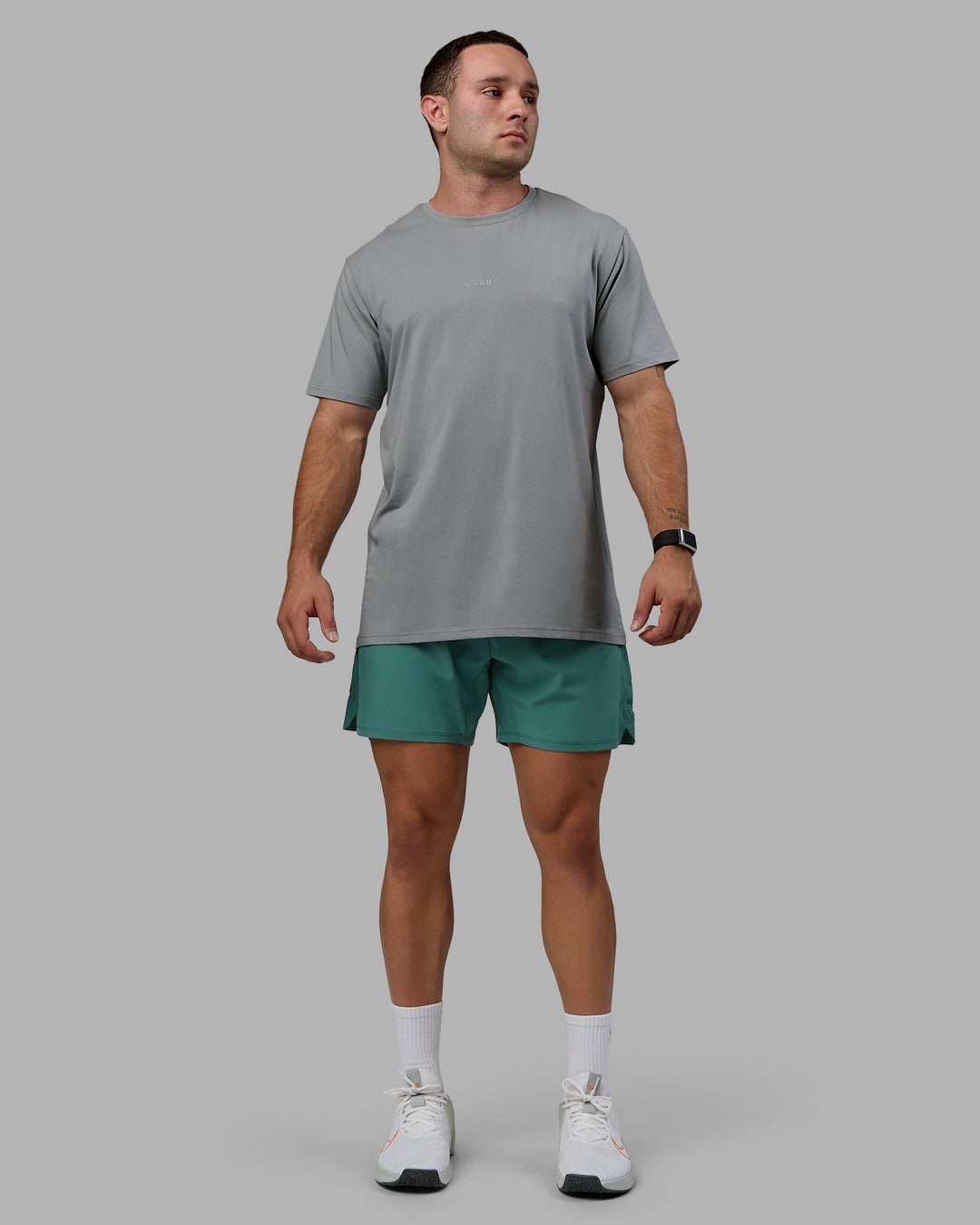 Man wearing Challenger 6&quot; Lined Performance Shorts - Sagebrush