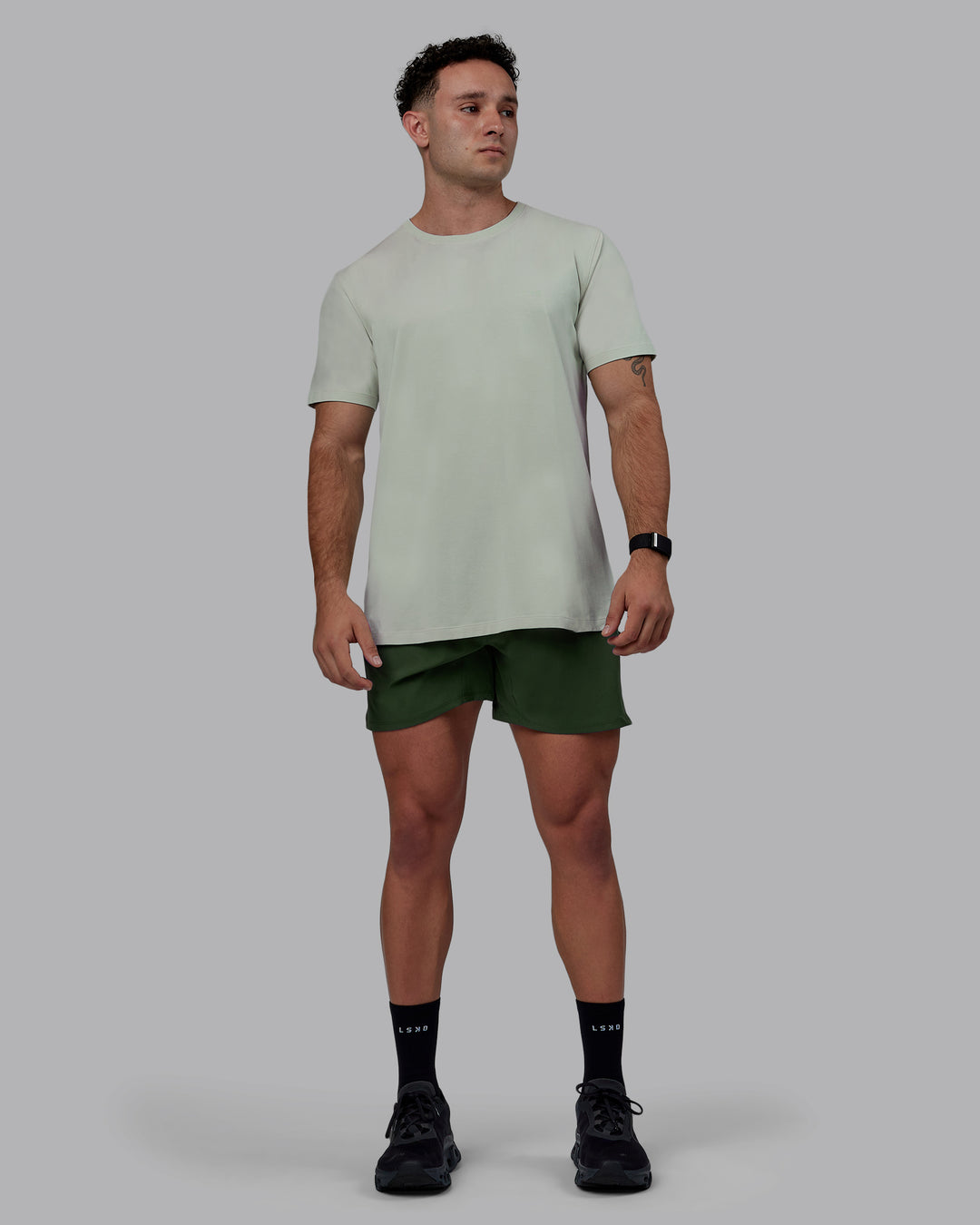 Man wearing Challenger 6&quot; Performance Shorts - Cilantro