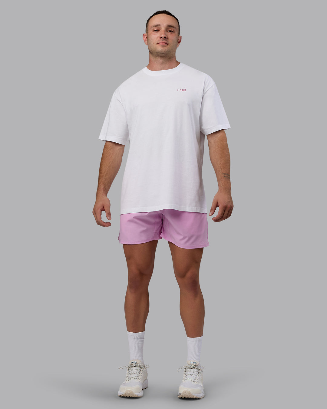 Man wearing Challenger 6&quot; Performance Shorts - Pastel Orchid