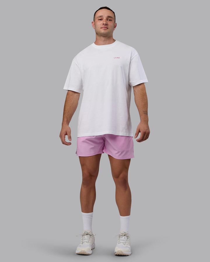 Man wearing Challenger 6&quot; Performance Shorts - Pastel Orchid
