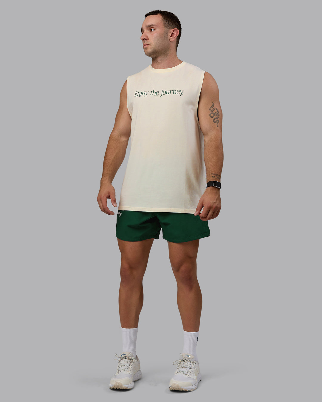 Man wearing Enjoy The Journey FLXCotton Tank - Off White-Deep Emerald