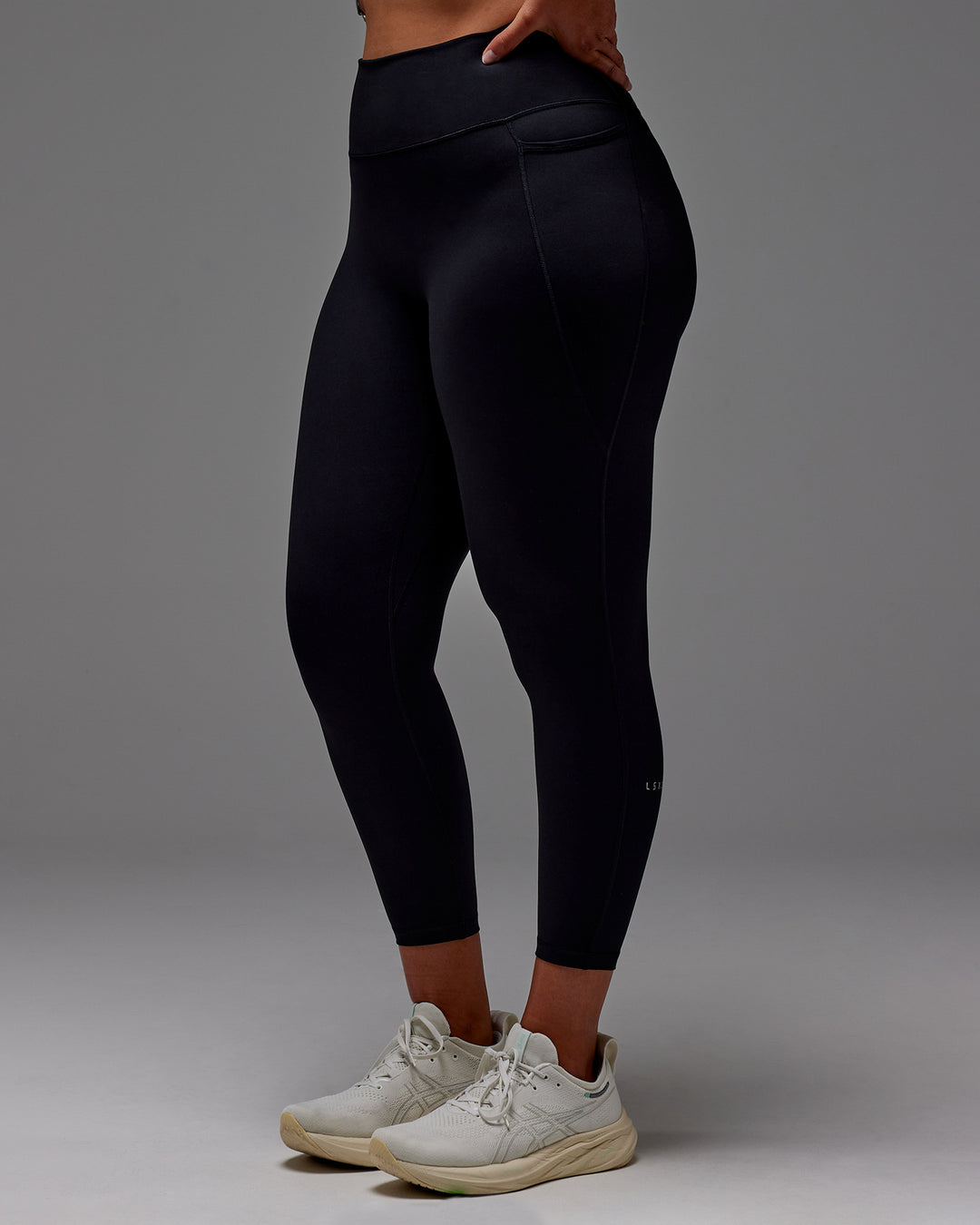 Woman wearing Fusion 7/8 Length Tight With Pockets in Black | Model:Aimee | Size:XL