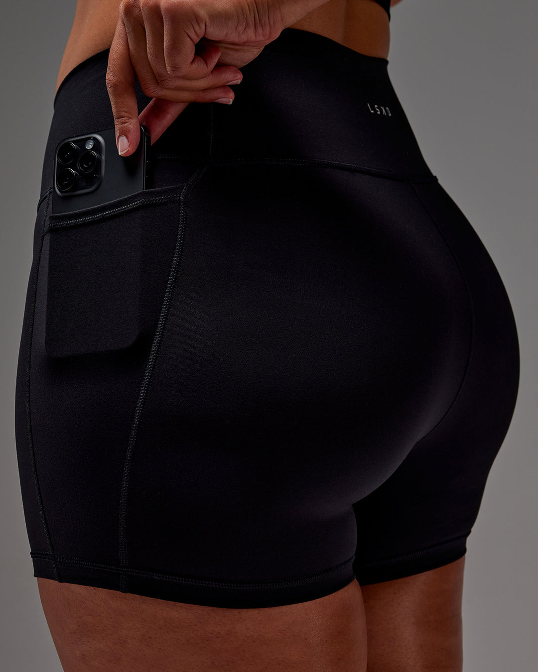 Woman wearing Fusion X-Short Tight With Pockets in Black | Model:Aimee | Size:XL