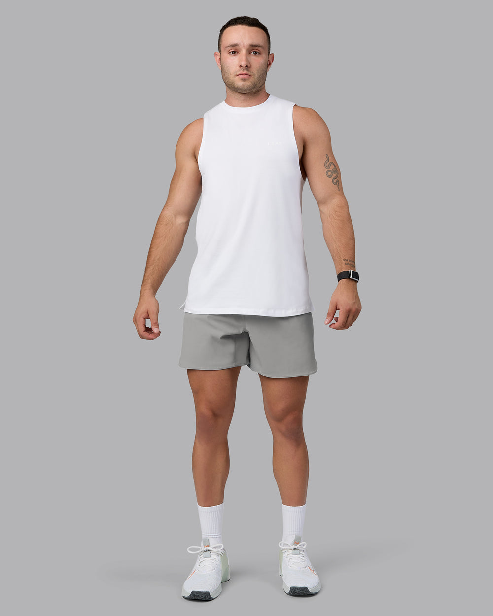 Man wearing Lift 6" Performance Shorts - Circular Grey