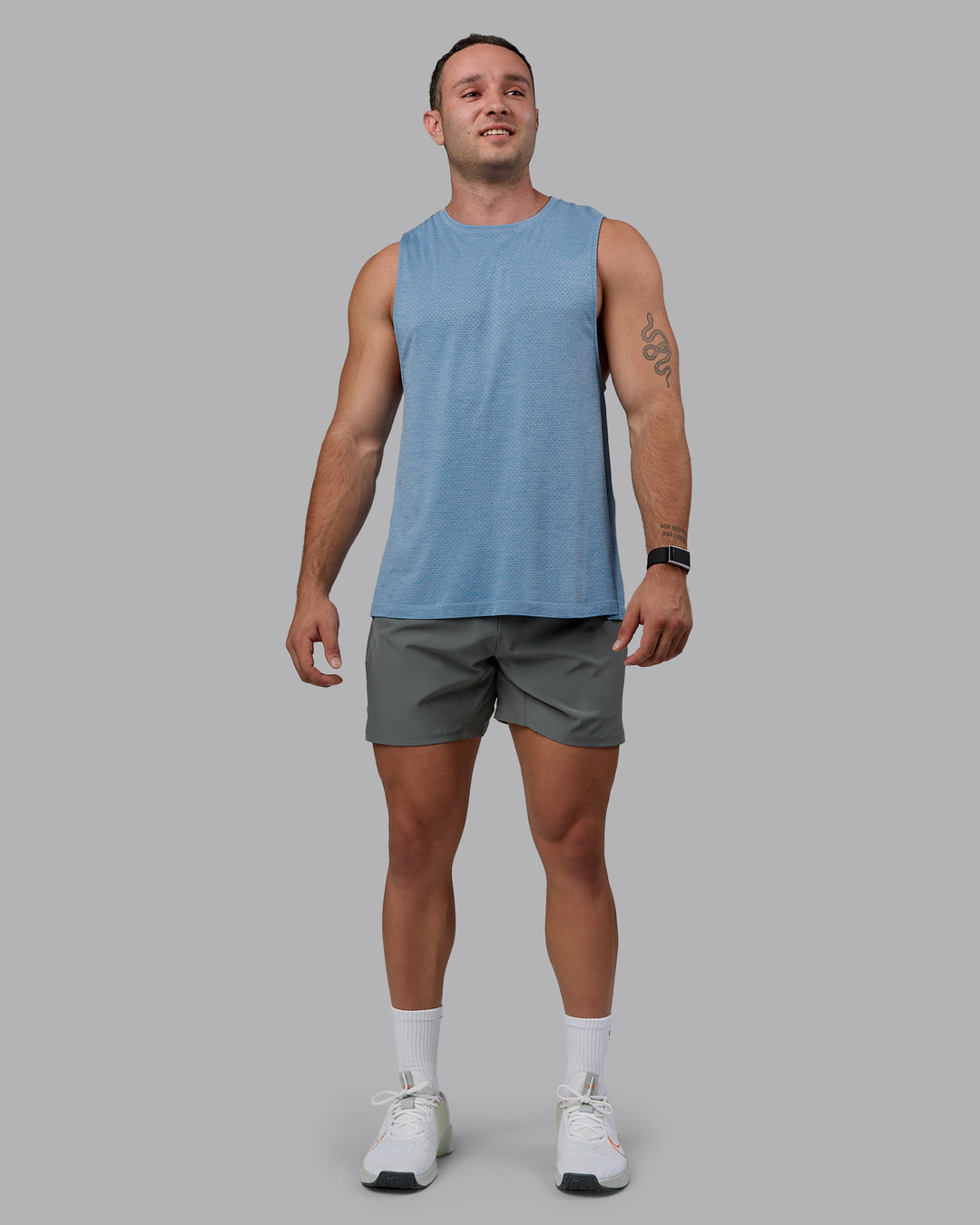 Man wearing AeroFLX+ Seamless Muscle Tank - Elemental Blue/Ice Blue