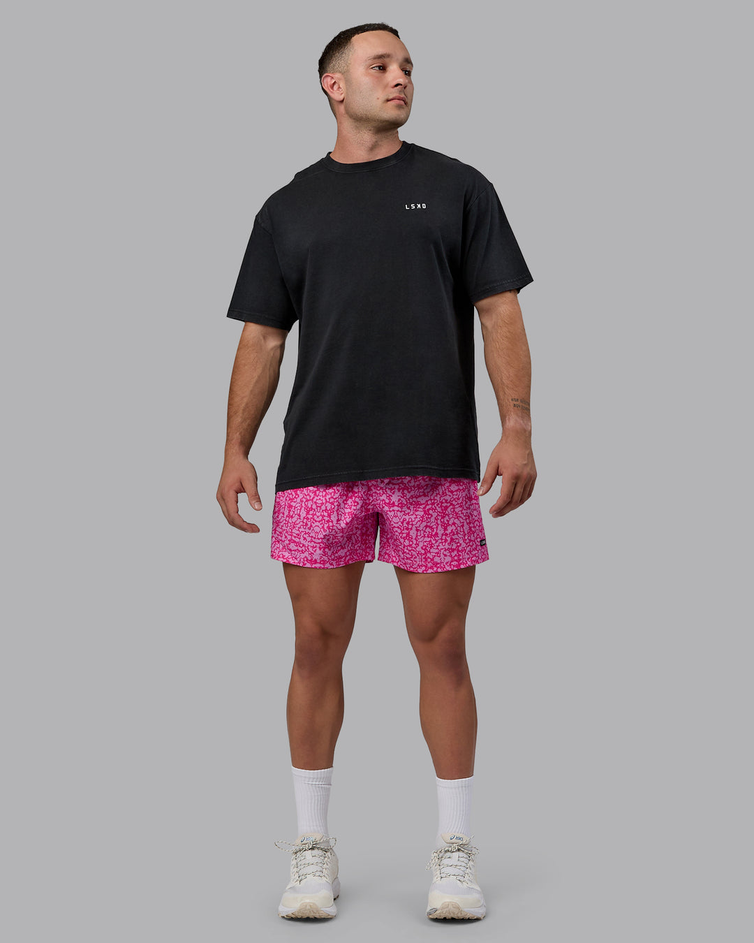 Man wearing Rep 5&quot; Performance Shorts - Patina Pastel Orchid