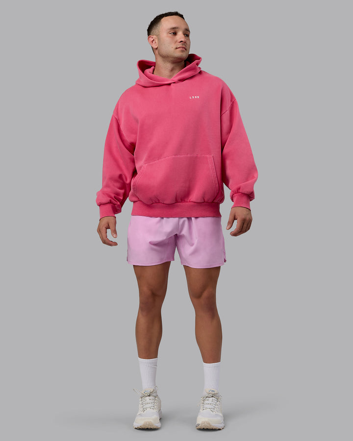 Man wearing Unisex Washed Empower Hoodie Oversize - Berry Pink-Pastel Orchid
