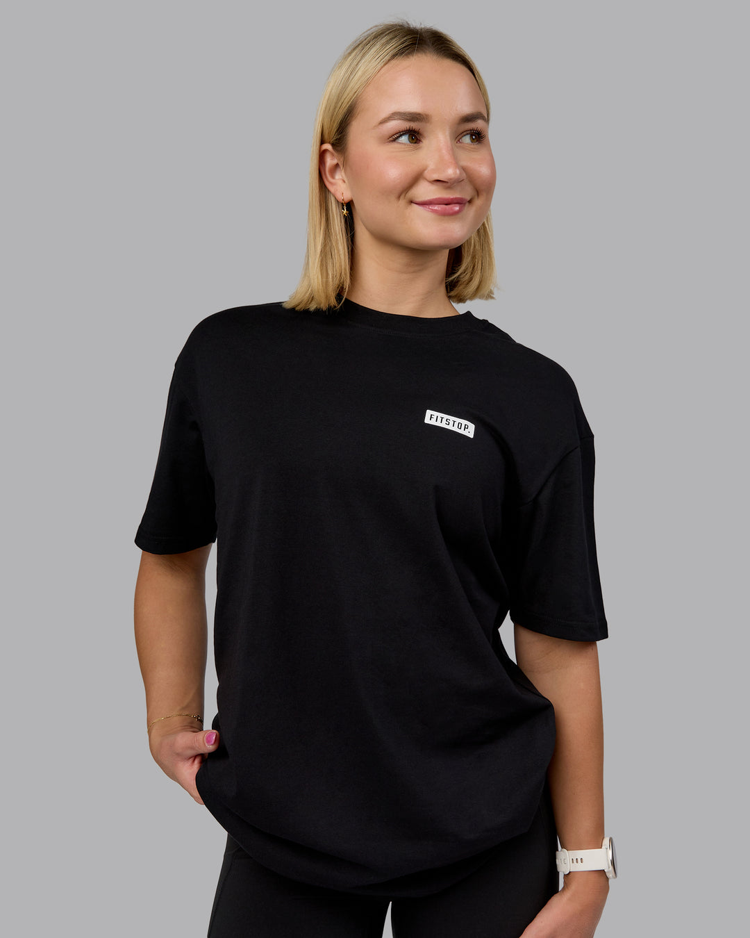 Woman wearing Fitstop Embrace the Sweat FLXCotton Oversized Tee in Black-White | Size:XS