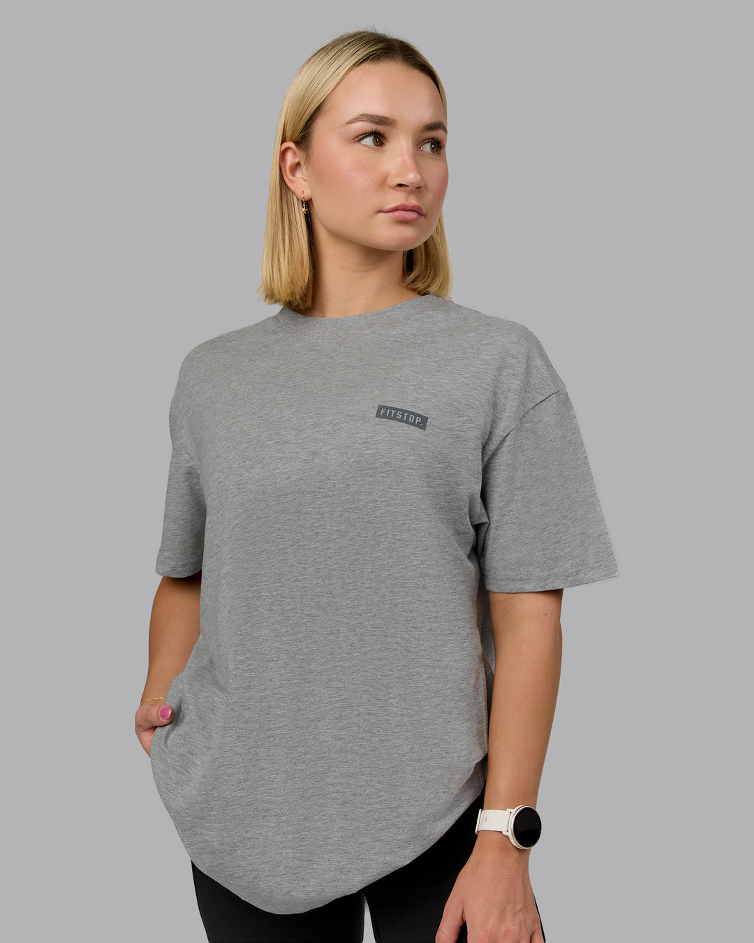 Woman wearing Fitstop Embrace the Sweat FLXCotton Oversized Tee in Light Grey Marl-Cool Grey | Size:XS