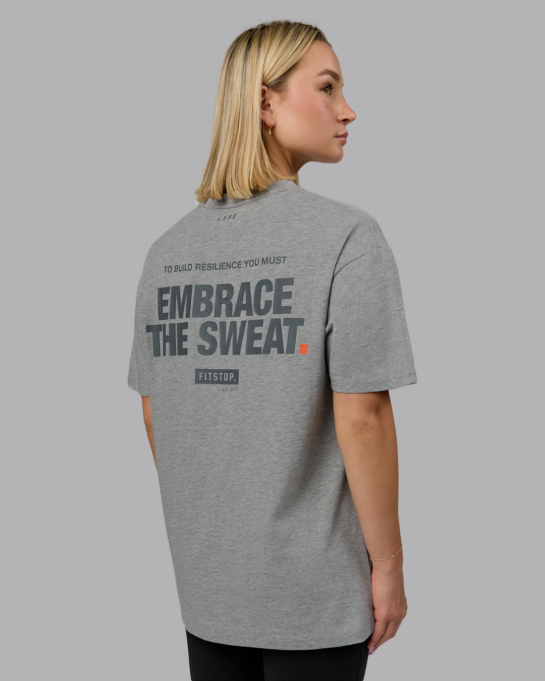 Woman wearing Fitstop Embrace the Sweat FLXCotton Oversized Tee in Light Grey Marl-Cool Grey | Size:XS