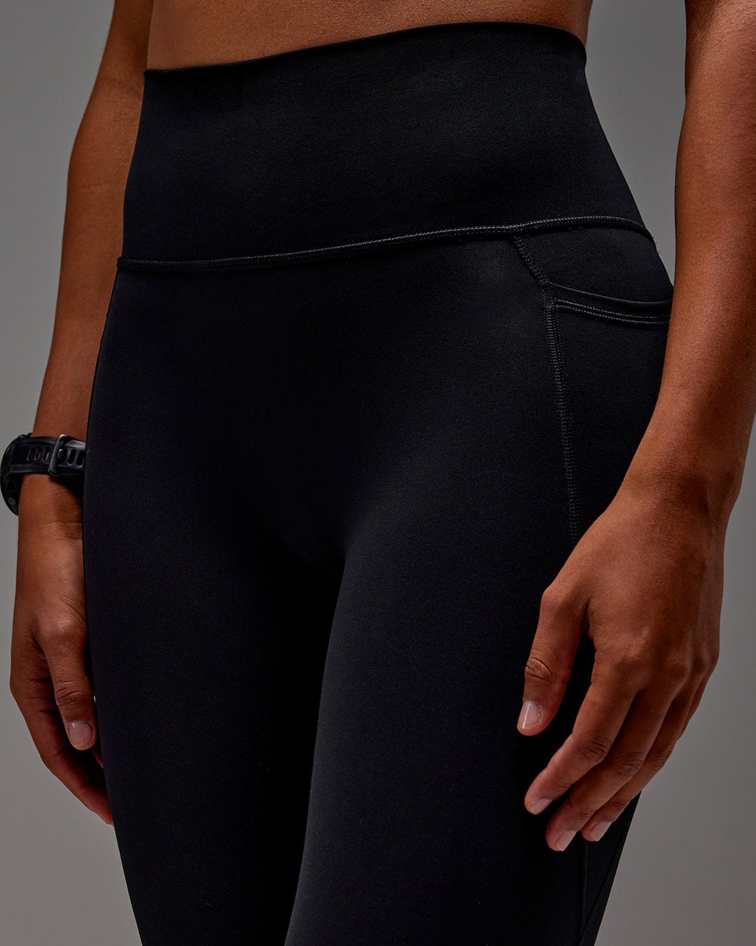 Woman wearing Fusion 7/8 Length Tight With Pockets in Black | Model:Txai | Size:XS