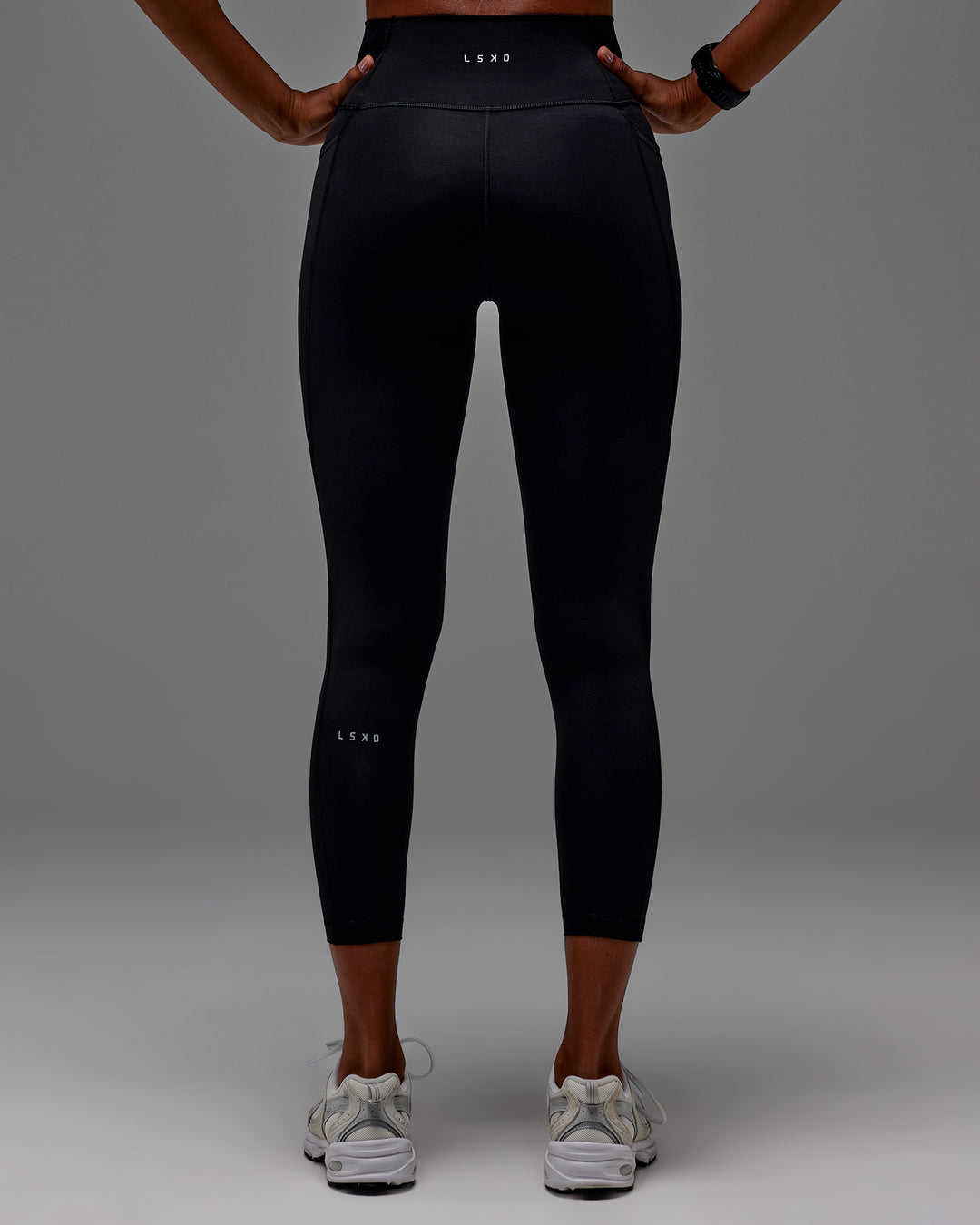 Woman wearing Fusion 7/8 Length Tight With Pockets in Black | Model:Txai | Size:XS