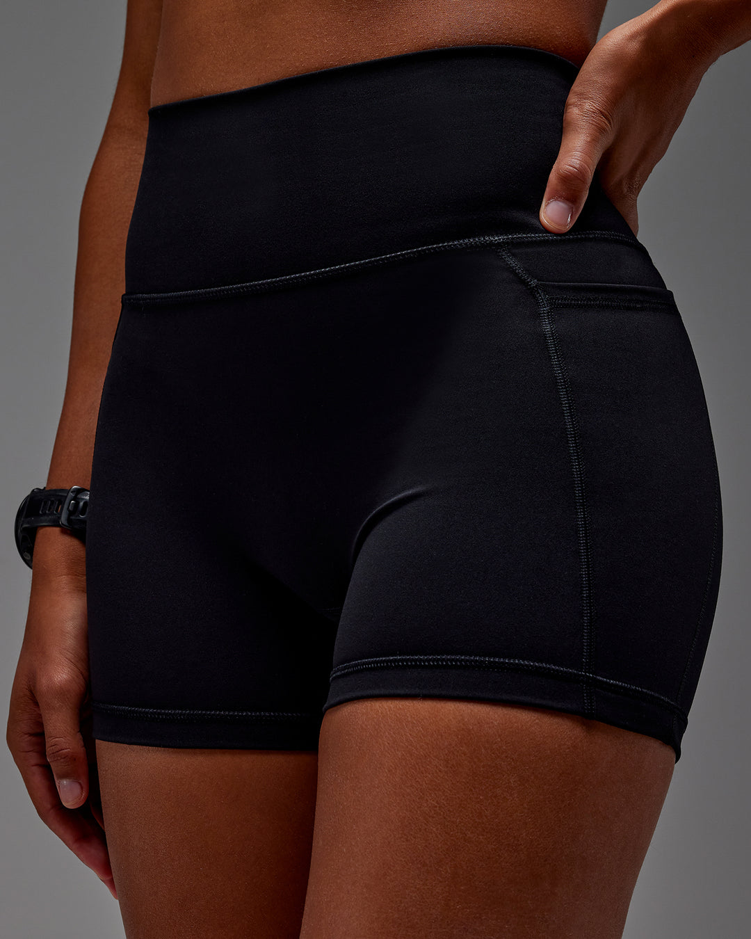 Woman wearing Fusion X-Short Tight With Pockets in Black | Model:Txai | Size:XS