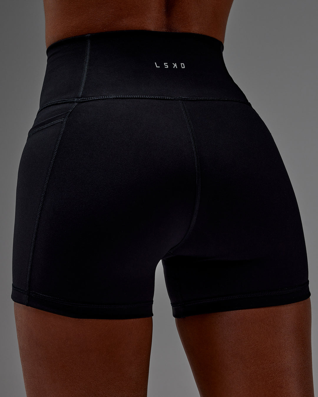 Woman wearing Fusion X-Short Tight With Pockets in Black | Model:Txai | Size:XS