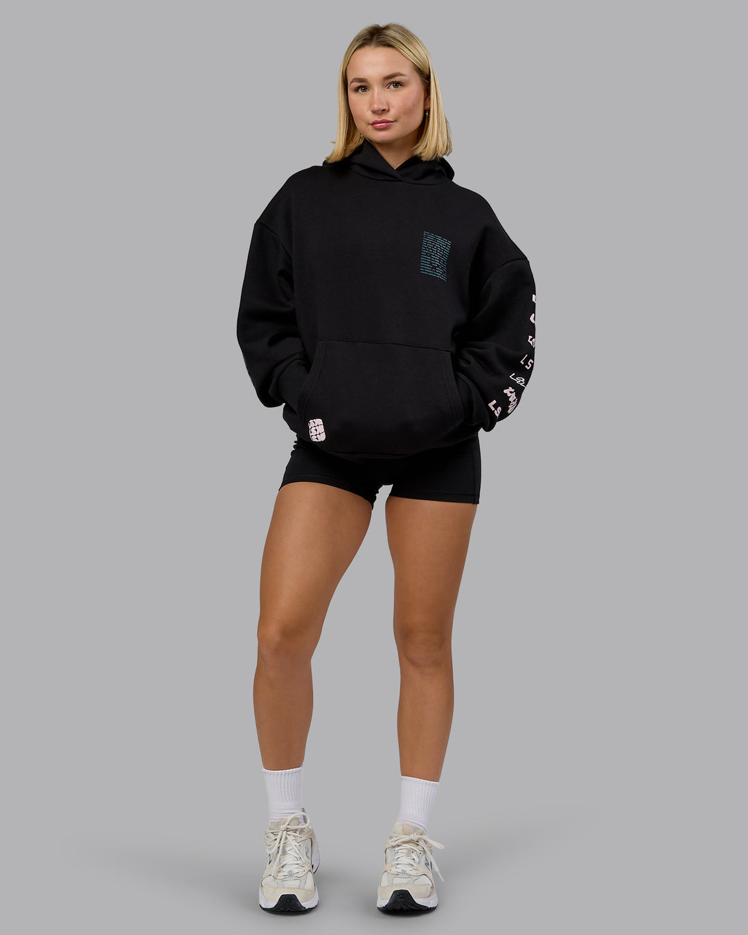 Woman wearing Displacement Oversized Hoodie - Black-Blue Coral | Model:Halle | Size:XS