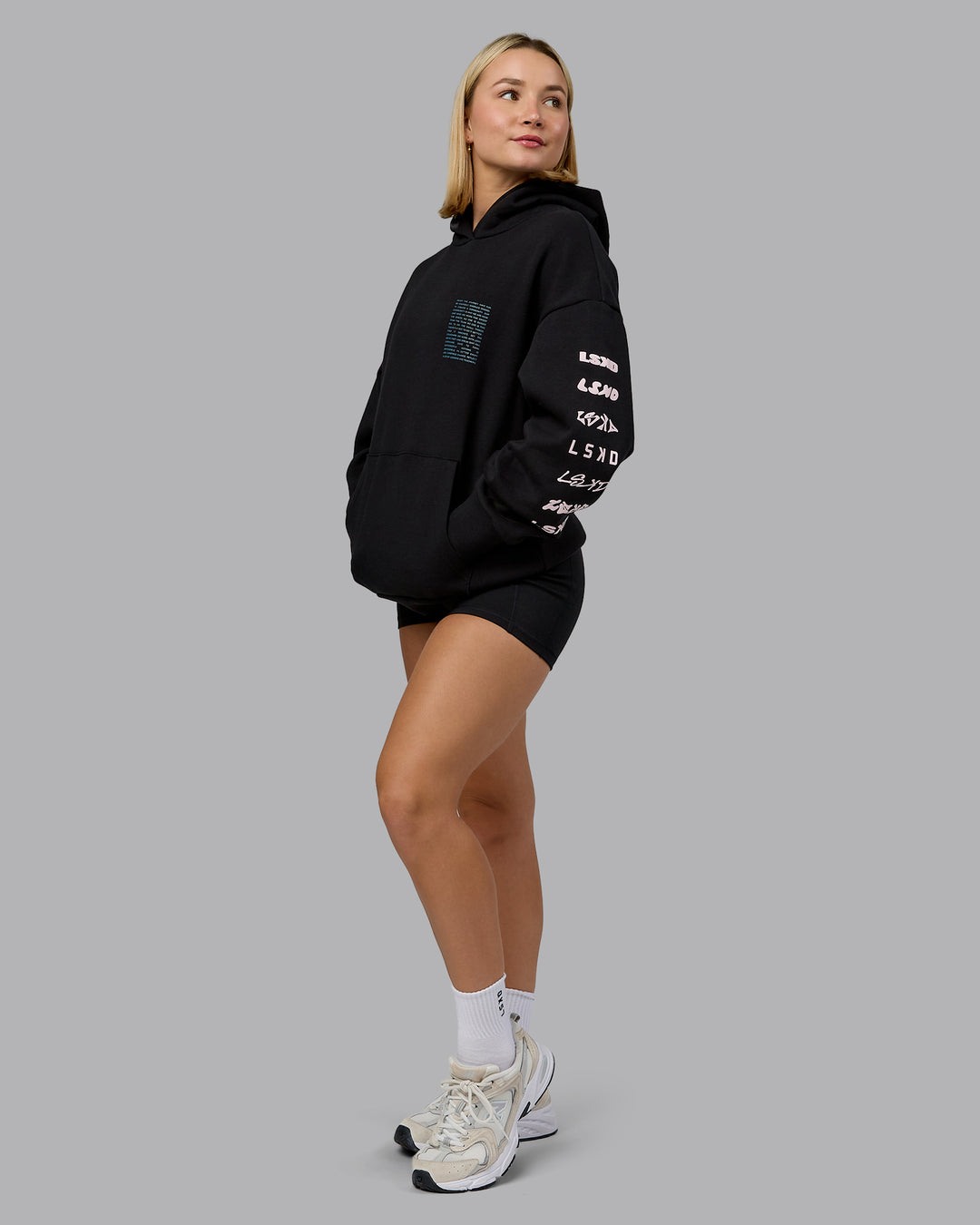 Woman wearing Displacement Oversized Hoodie - Black-Blue Coral | Model:Halle | Size:XS