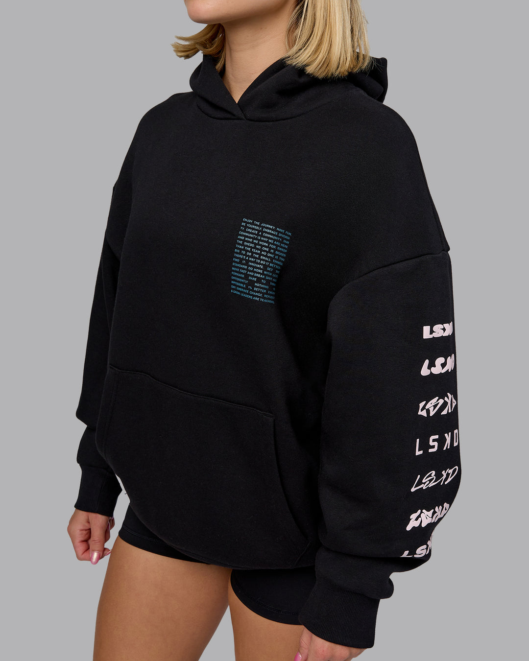 Woman wearing Displacement Oversized Hoodie - Black-Blue Coral | Model:Halle | Size:XS