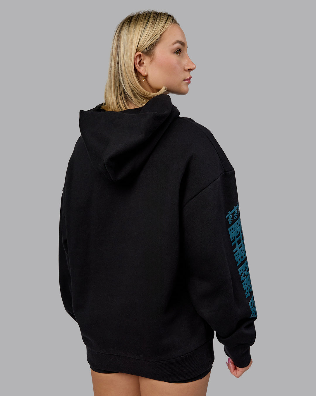 Woman wearing Displacement Oversized Hoodie - Black-Blue Coral | Model:Halle | Size:XS