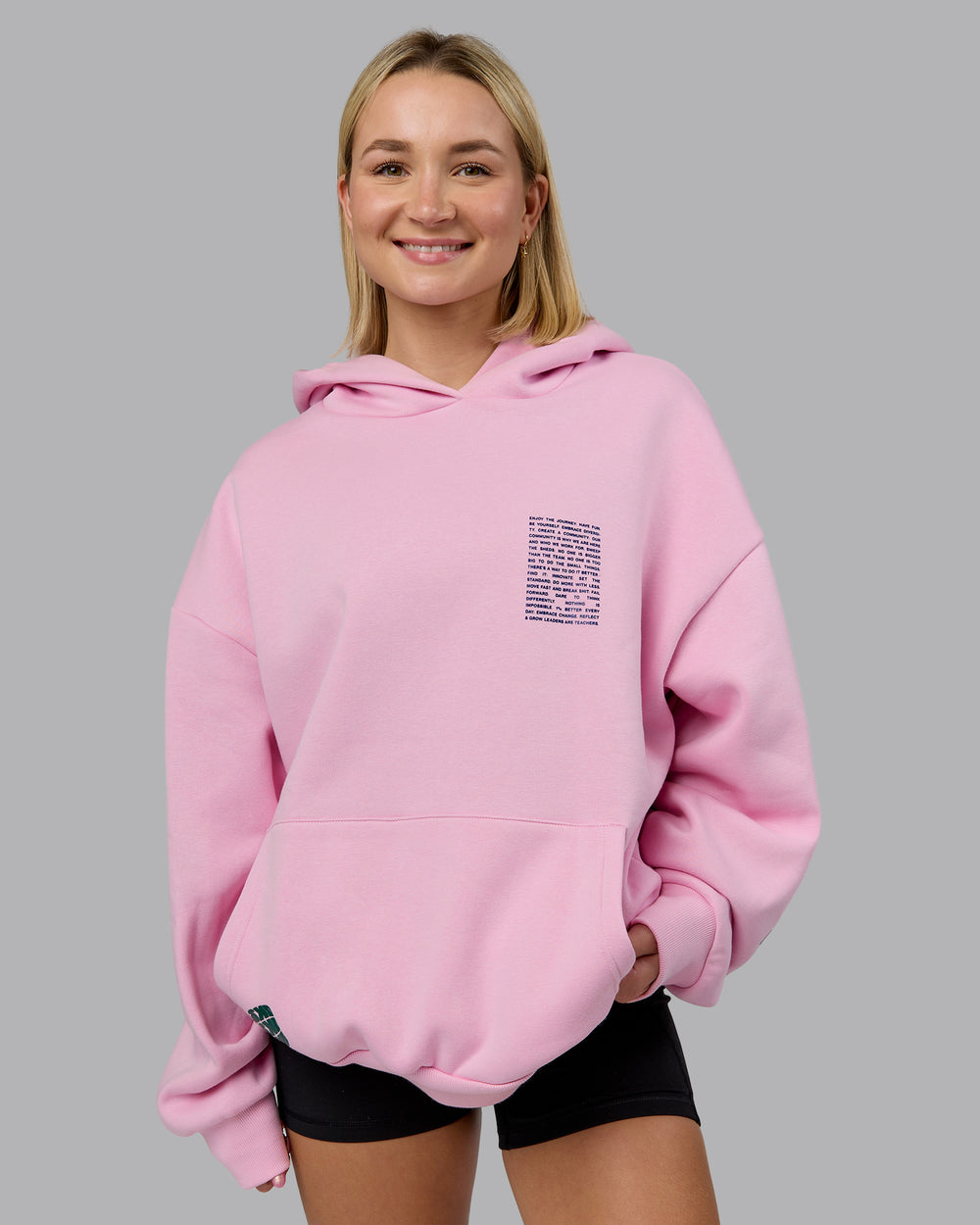 Woman wearing Displacement Oversized Hoodie - Light Bubblegum-Dark Moss | Model:Halle | Size:XS