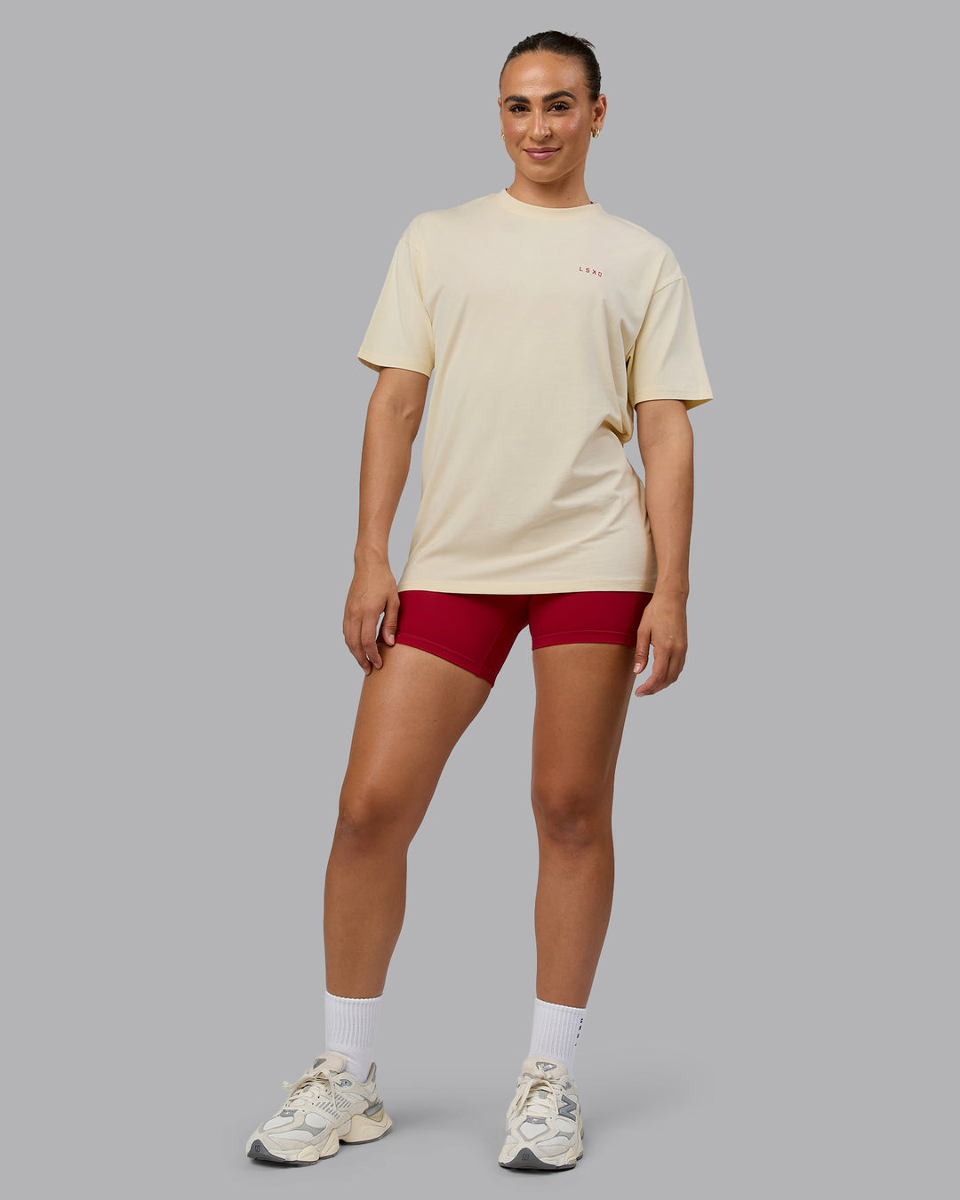 Woman wearing Unisex Enjoy the Journey Value Series FLXCotton Tee Oversize - Ivory-Cherry Red