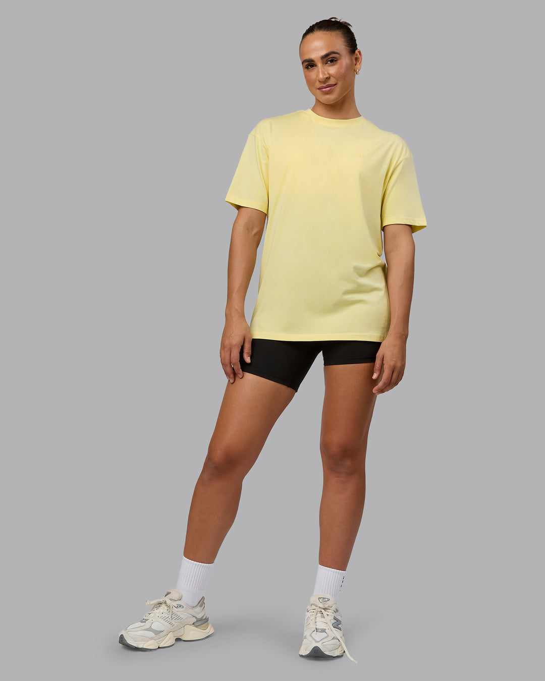 Woman wearing Unisex Enjoy the Journey Value Series FLXCotton Tee Oversize - Pale Yellow-Sundress